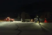 A truck was transporting a trailer with sand, the trailer slid out and an axle on it broke so it is no longer able to drive.