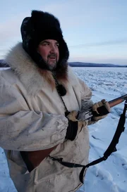 Charlie Wright poses for the camera while trapping.