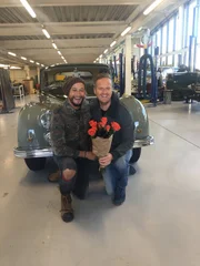 Tim and Fuzz posed infront of the Landrover Defender with some flowers. (National Geographic/Stephen Taylor Woodrow)