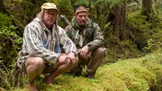USA, Washington, Olympic National Forest, Cody Lundin and Dave Canterbury walking through Pacific Northwest rainforest during Dual Survivor filming.
