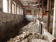 An abandoned section of the mill with rubbish and bricks. An abandoned section of the mill with rubbish and bricks.