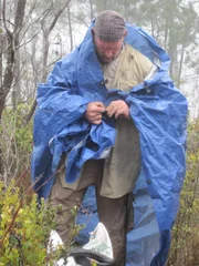 Dave Canterbury wrapping himself in a tarp to stay protected in Dominican Republic. Dave Canterbury wrapping himself in a tarp to stay protected in Dominican Republic.