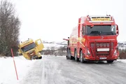 Jo Roger plans on pulling the snow plough out diagonally in Oestre, Naeroeysund, Norway. (National Geographic)