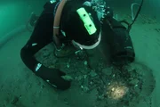 Underwater dredger  digging through cobble. Underwater dredger  digging through cobble.