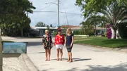 Real estate agent Sarah Strobel (R) gives contributors Willow Shambeck (L) and Sandi Bargfrede (C) the lowdown on what they can expect to find when they tour Breezy Bungalow as seen on HGTV's Beachfront Bargain Hunt.