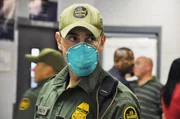 Nogales, Arizona, USA: Border Patrol agent wears a mask to prevent the spread of swine flu.