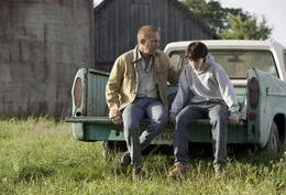 L - R: Jonathan Kent (Kevin Costner), Clark Kent (13 Years) (Dylan Sprayberry)