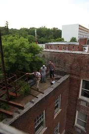 Hot Springs, AR USA: Jay leads the team across rooftops and fire escpaes to scavenge for any interesting items
