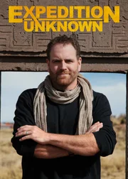 Josh Gates in front of the Gate of the Sun.