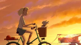 Fritzi f&auml;hrt Fahrrad. Sputnik sitzt vorne im K&ouml;rbchen.