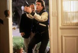 Detective Martin Riggs's (Mel Gibson) latest official duty is to provide protective custody for federal witness Leo Getz (Joe Pesci, left).