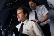 Captain Kevin Sullivan (played by Jerry Getty) enters the cockpit and guides second officer Ross Hales (Spencer Robson). Captain Kevin Sullivan (played by Jerry Getty) enters the cockpit and guides second officer Ross Hales (Spencer Robson).