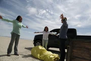 BLACK ROCK DESERT, NEV. - Volunteers; James Fitzsimmons, Joy Ng and CaTamira Babino unpack the replica sun for the solar system demo.