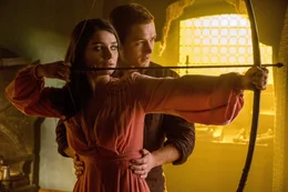 L-R:  Marian (Eve Hewson) and Robin of Loxley (Taron Egerton)