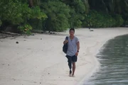 Dr. Albert Lin walks along the beach of Ant Atoll, Micronesia.