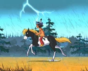 Yakari und Kleiner Donner reiten durch Blitz und Regen.