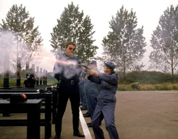 On the left: Sgt. Eugene Tackleberry (David Graf)