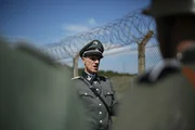 RE-CREATION - Eicke talks to his SS soldiers. He runs the camp with his highly trained SS troops.
