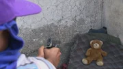 GUATEMALA CITY, GUATEMALA- El Chiquito shooting A toy bear. GUATEMALA CITY, GUATEMALA- El Chiquito shooting A toy bear.