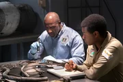 The Lead Namibian Investigator (played by Jamaal Grant) and Investigator Dennis Jones (played by Glen Michael Grant) take a closer look at pieces of wreckage from LAM Mozambique Flight 470. (Cineflix/Pana Pantazidis) The Lead Namibian Investigator (played by Jamaal Grant) and Investigator Dennis Jones (played by Glen Michael Grant) take a closer look at pieces of wreckage from LAM Mozambique Flight 470. (Cineflix/Pana Pantazidis)