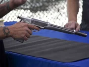 The striking profile of the Anti-Bandit Gun in Adrian Alford's hand. A double barreled 20-gauge shotgun, in pistol form. The striking profile of the Anti-Bandit Gun in Adrian Alford's hand. A double barreled 20-gauge shotgun, in pistol form.