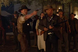 1873. Als das St&auml;dtchen Absolution von Au&szlig;erirdischen angegriffen wird, m&uuml;ssen sich die beiden unterschiedlichen M&auml;nner, Gangsterboss Jake Lonergan (Daniel Craig, l.) und der herrische Viehbaron Dolarhyde (Harrison Ford, vorne r.), zusammenschlie&szlig;en, um gemeinsam Widerstand gegen die gnadenlosen Aliens zu leisten ...