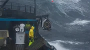The Summer Bay deckhands hauling gear in rough seas.