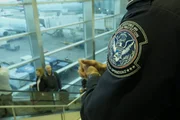 Miami, FL - Passengers are coming up the elevator as Officer Rimola (on the right) is looking over them. (National Geographic/Lucky 8 TV)