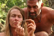 Kellie finds food as EJ looks on over her shoulder.