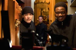 In the back: Rusty Ryan (Brad Pitt). In the front L-R: Danny Ocean (George Clooney), Frank Catton (Bernie Mac)