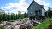 Jonathan Knight’s lifted New England farmhouse which will soon be moved down the road, as seen on Farmhouse Fixer.