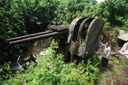 MICRONESIA - Tony Pollard posing with an anti-aircraft gun.