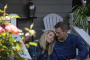 Justin consoles his wife Tina outside on the porch.