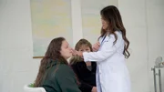 Dr. Sandra Lee examines Christina C. hidrocystomas around her eyes.