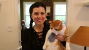 Nora holds Sleeve.