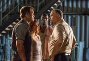 L-R: Owen Grady (Chris Pratt), Claire Dearing (Bryce Dallas Howard), Barry (Omar Sy), Vic Hoskins (Vincent D'Onofrio).