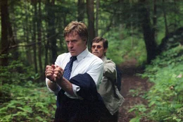 L-R: Wayne Hayes (Robert Redford) and Arnold Mack (Willem Dafoe)