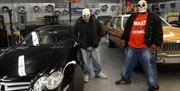 OAKLAND, CALIF.- 'Sparks' and his colleague standing in front of two of their latest vehicles.