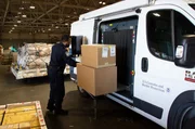 Officer Richard Stephens places packages on X-ray machine for a thorough inspection. (National Geographic/Lucky 8 TV)
