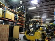 Jose pulling down Alonzo Mourning's tank with forklift.
