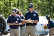 REENACTMENT - NTSB Investigator Joe Sedor (played by Jason Faulkner) prepares notes of the wreckage of downed Comair Flight 5191 while other NTSB Crash Investigators secure pieces of evidence and document their findings.