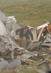 REENACTMENT - William McGrory (played by Benjamin James), a survivor of downed Ansett New Zealand Flight 703 stumbles out of the plane's wreckage.