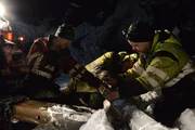 Odda, Norway - Tor Steinar Tveit, Thord Paulsen and Olav Eike are trying to remove the road safety barriers.