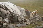REENACTMENT - William McGrory (played by Benjamin James), a survivor of downed Ansett New Zealand Flight 703, attempts to dislodge wreckage in search of other survivors. (Cineflix 2020/Darren Goldstein)