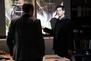 REENACTMENT - The Lead Investigator (played by Mike Shara) and the Second Investigator (played by Wes Berger) analyze photos of the wheel well of downed Propair Flight 420. (Cineflix)