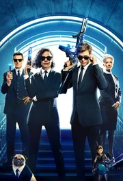 L-R: Agent High T (Liam Neeson), Agent M (Tessa Thompson), Agent H (Chris Hemsworth), Agent O (Emma Thompson).