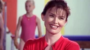 Monica (Roma Downey).