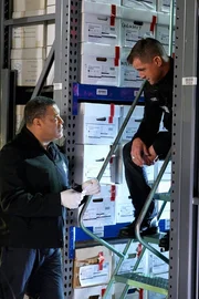 "Neverland" -- Dr. Raymond Langston (Laurence Fishburne) investigates the suspicious death of a boy that may have taken place in a supposedly locked police evidence storage unit. Also pictured George Eads as Nick Stokes.