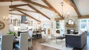 As seen on Fixer Upper, the Chapman's renovated house is open concept, with vaulted ceilings and exposed wood beams and plenty of natural light. (After #7)