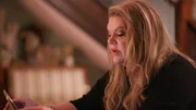 Robin Matthews looking at her tablet